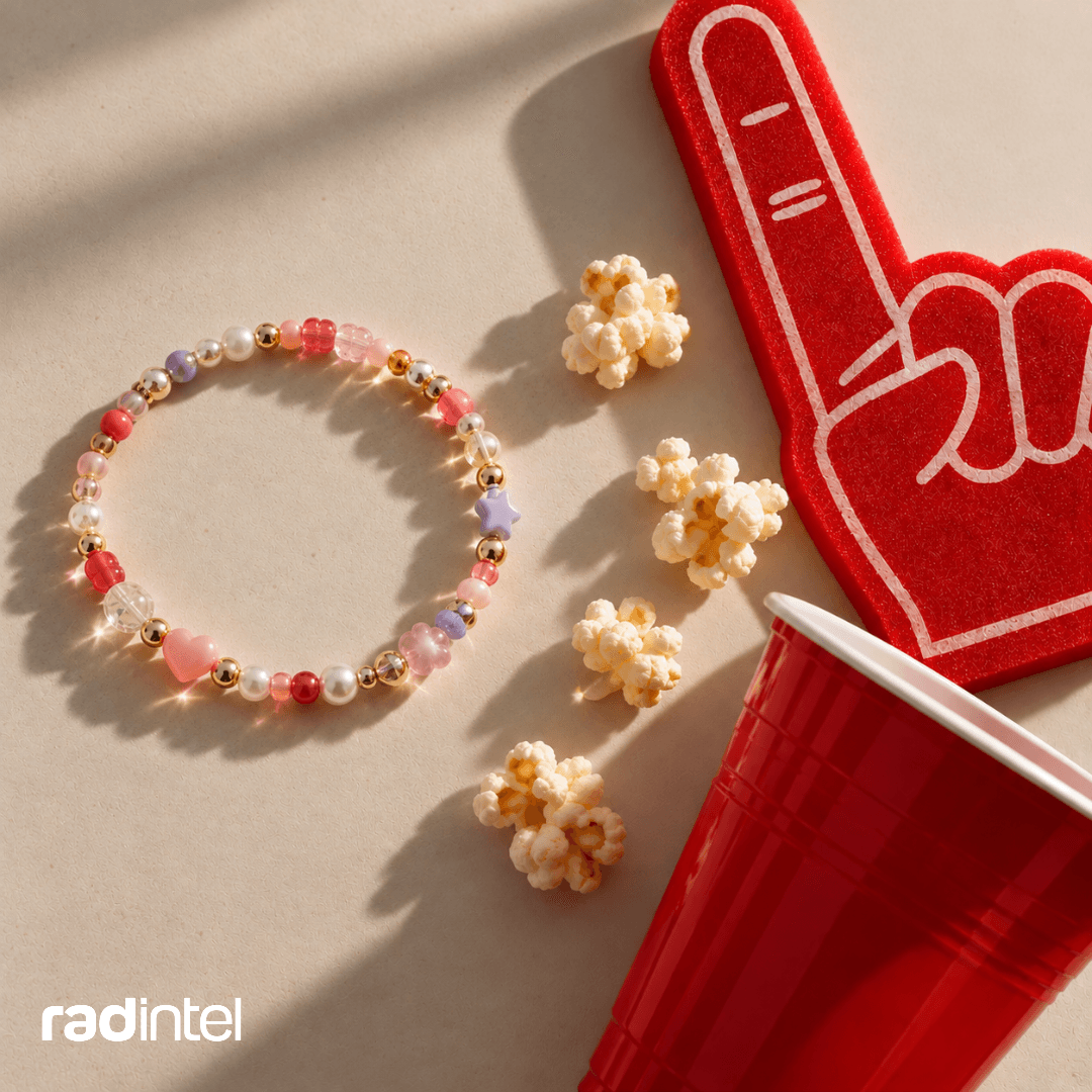 A beaded bracelet with a football foam finger.