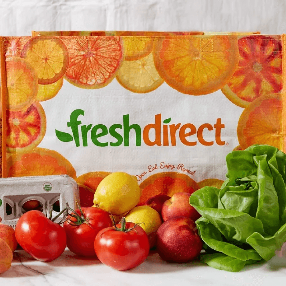 FreshDirect logo surrounded by fruits and vegetables