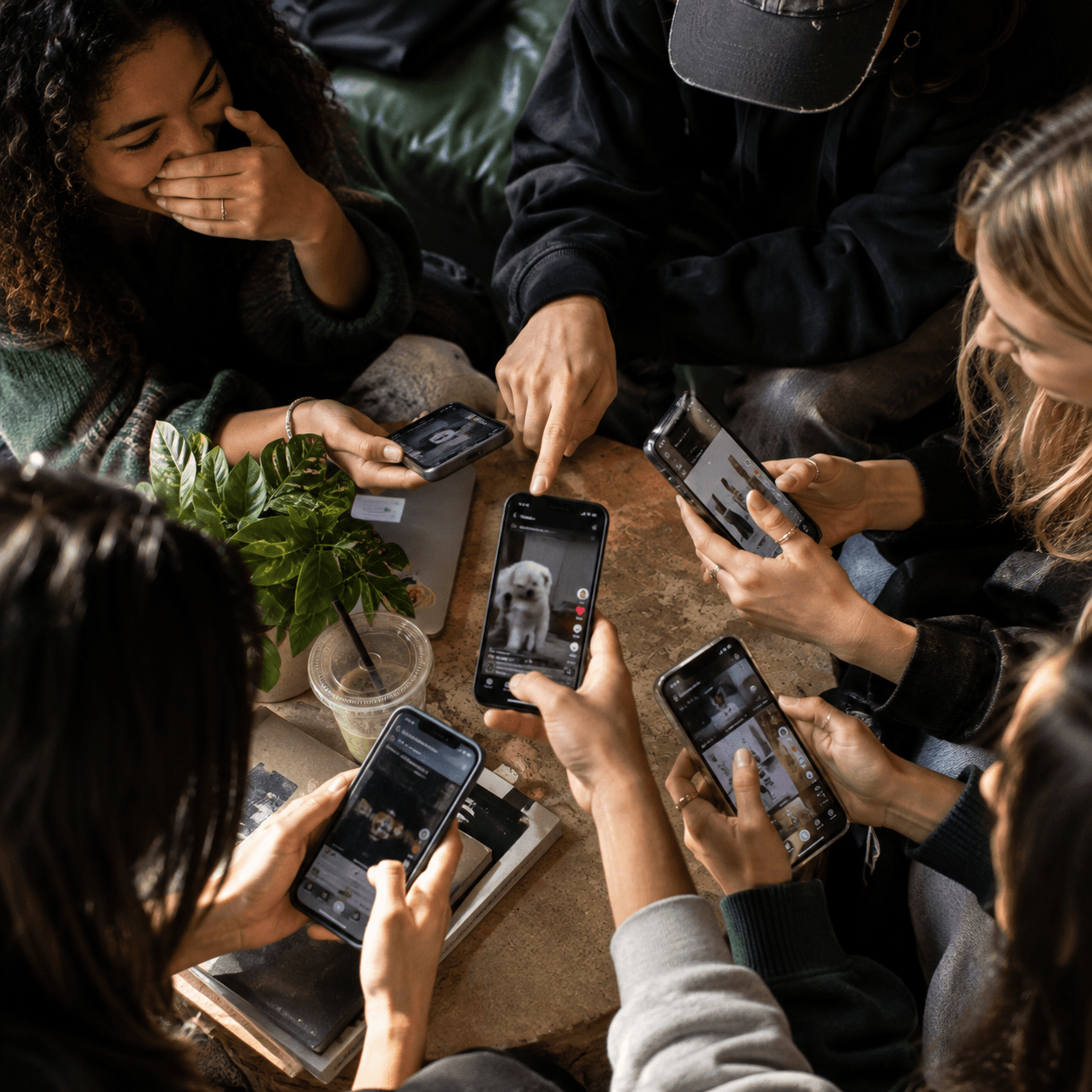 Gen Z teens sharing content and socially participating.