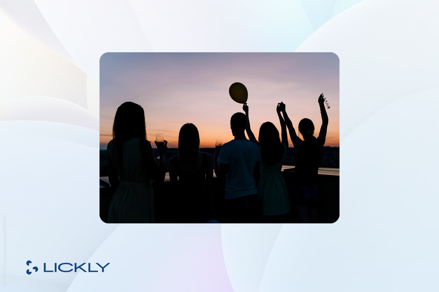 People in front of a sunset having fun