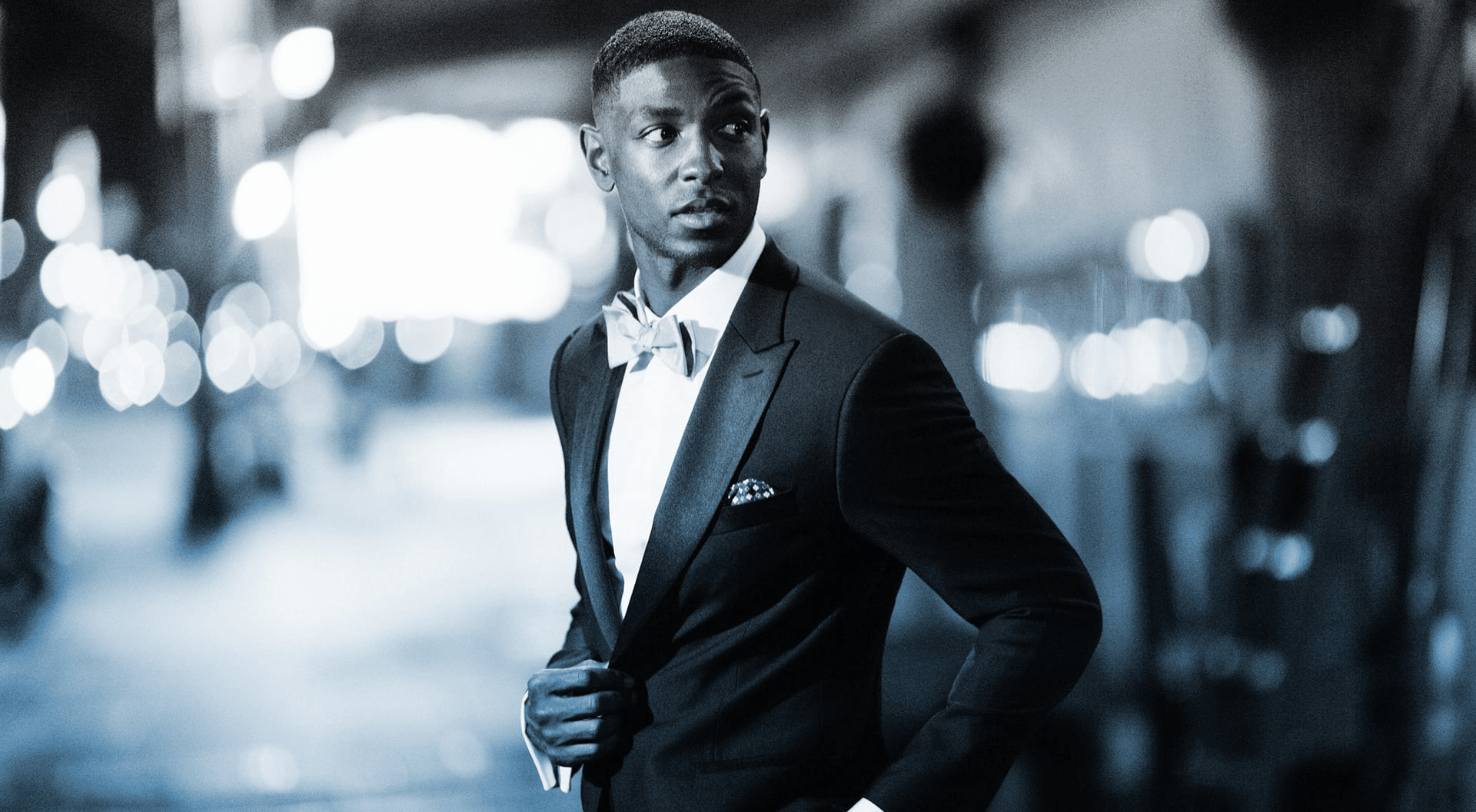 A person standing in a tuxedo