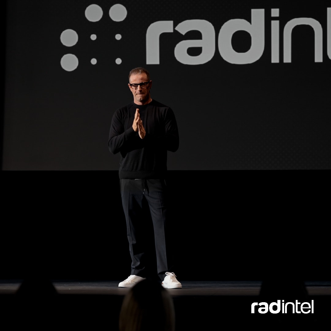 Jeremy Barnett speaking on stage at conference.