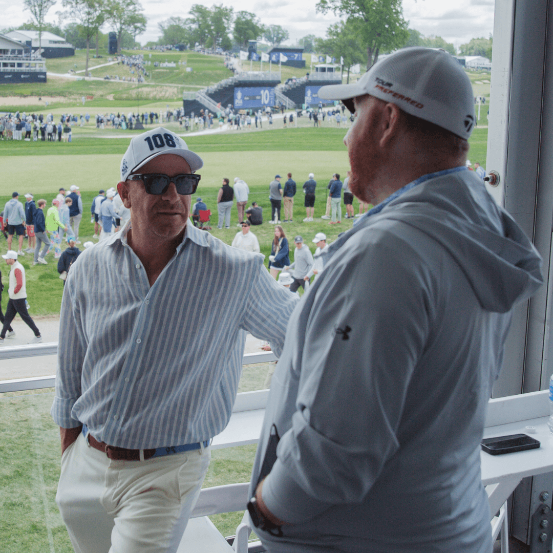 Jeremy Barnett speaking with investors at PGA Championship event.
