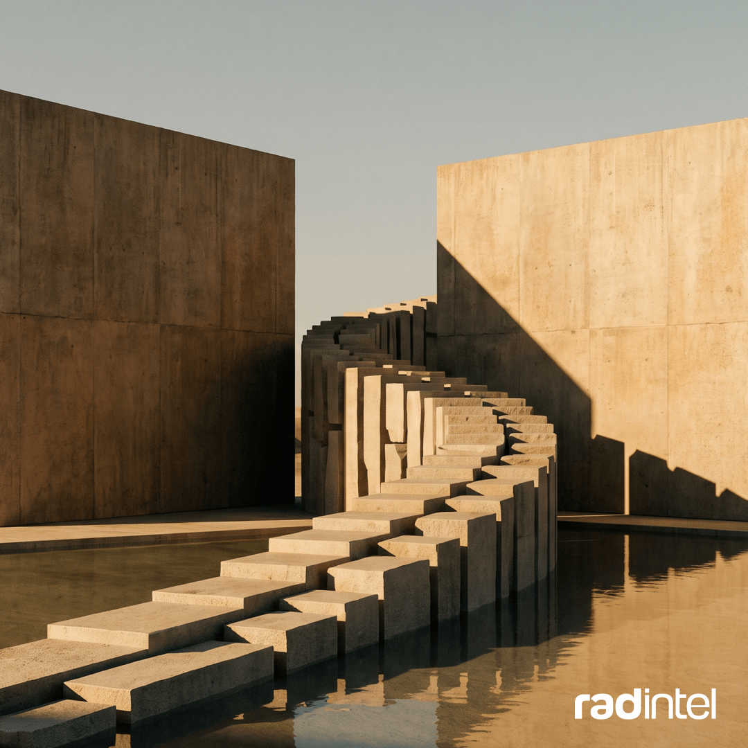 Stone steps curving between two tall concrete walls, rising over still water in warm afternoon light.