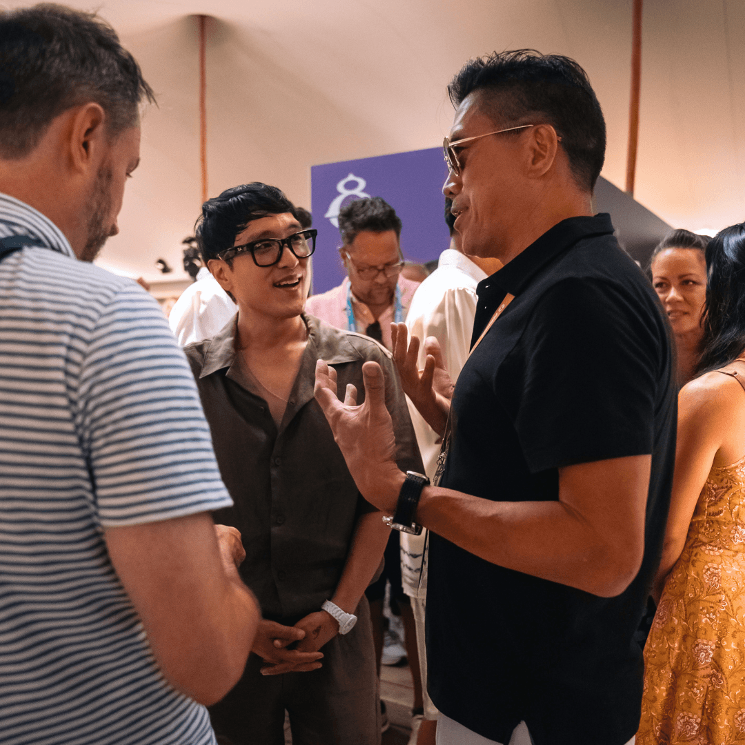 Tom Costello and Rick Song discussing panels at Cannes Lions 2026.